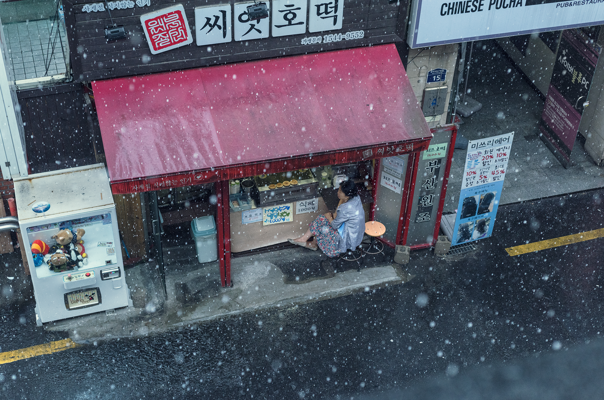 Woman Sheltering from Rainfall