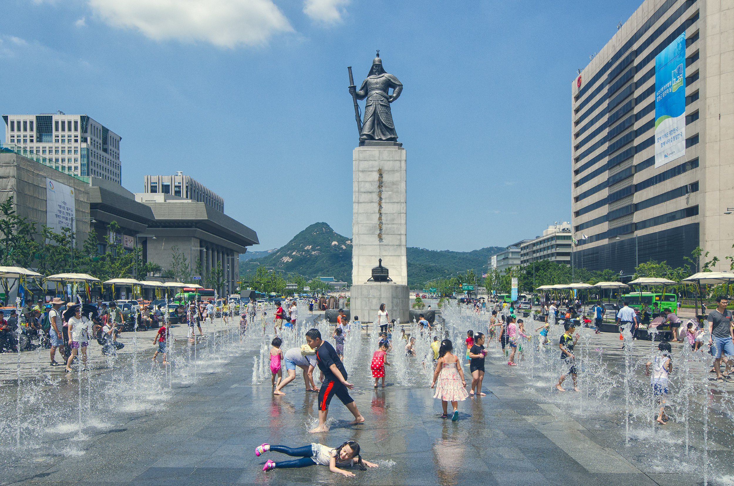 Children Playing Beneath a Statue of Admiral Yi Sun-Sin, Gwanghwamun Square, Seoul